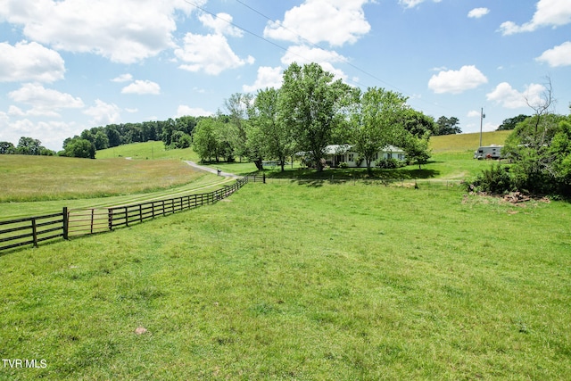 view of yard with a rural view