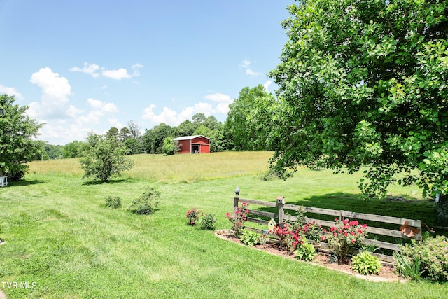 view of yard with a rural view