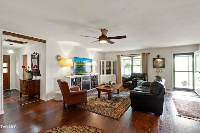 living room with wood-type flooring and ceiling fan