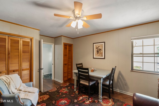 dining area featuring ornamental molding, dark hardwood / wood-style floors, and ceiling fan