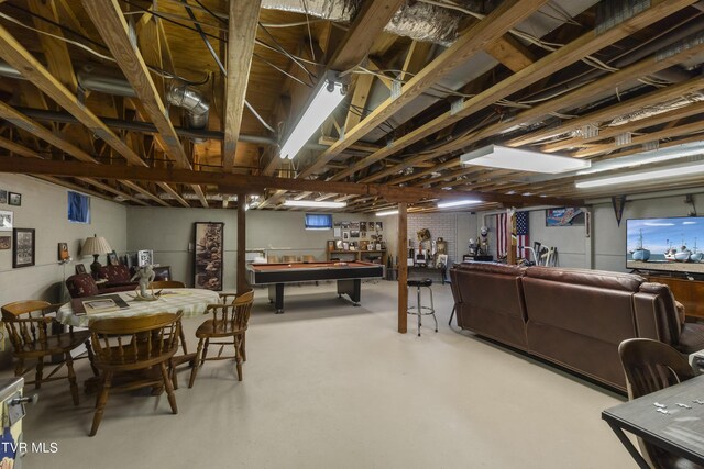 basement featuring bar area and pool table