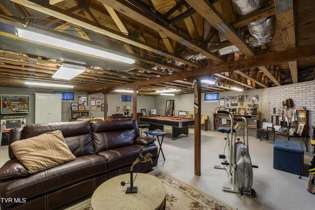 living room featuring concrete floors and pool table