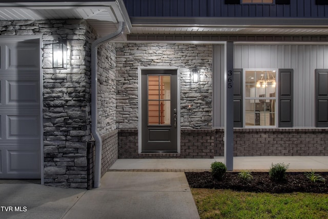 view of exterior entry featuring a garage