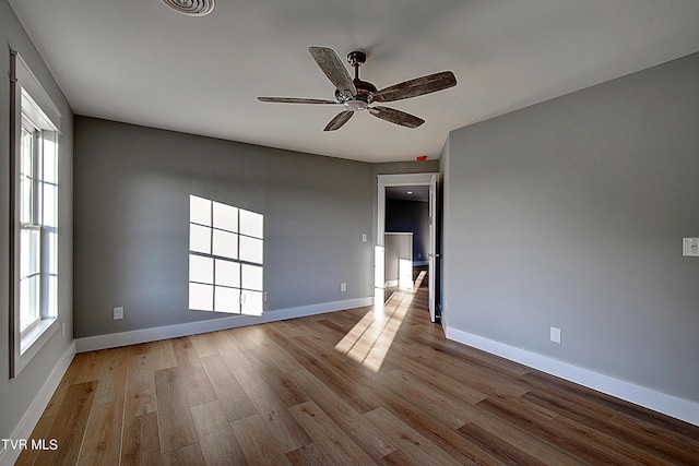 spare room featuring ceiling fan and light hardwood / wood-style floors