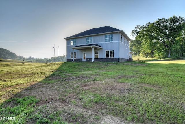 back of property with a yard