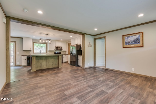 kitchen with white cabinets, black appliances, dark hardwood / wood-style floors, and a kitchen island