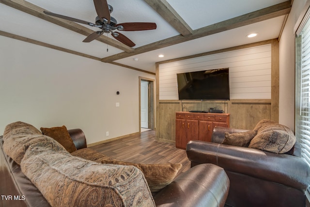 living room featuring beam ceiling, dark hardwood / wood-style floors, and ceiling fan