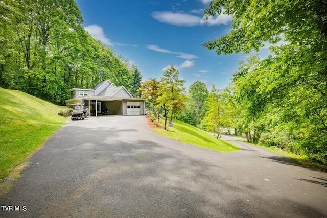 view of front of property with a garage and a front yard