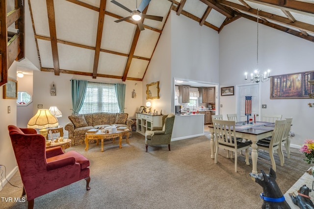 carpeted living room with beam ceiling, high vaulted ceiling, and ceiling fan with notable chandelier