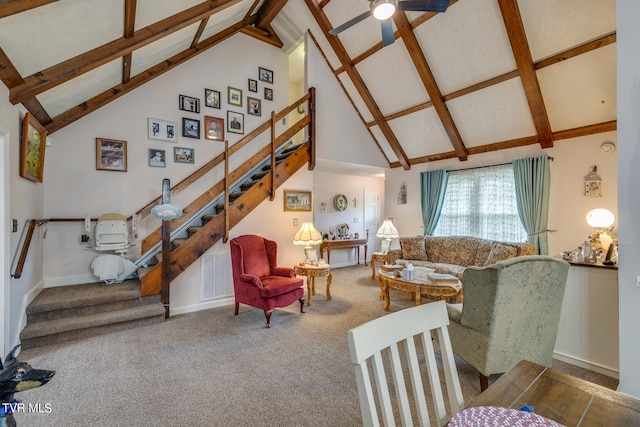 carpeted living room featuring vaulted ceiling with beams and ceiling fan