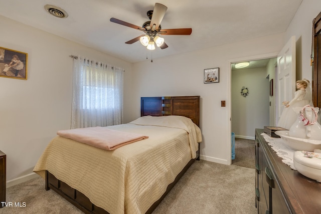 bedroom featuring light carpet and ceiling fan