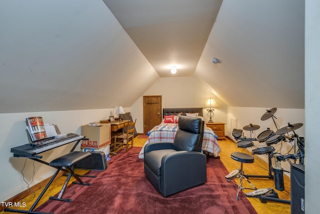 carpeted bedroom with vaulted ceiling