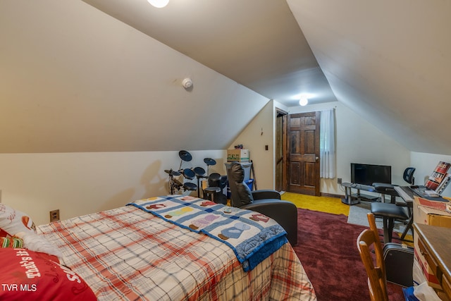 carpeted bedroom featuring vaulted ceiling