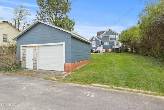 garage with a yard