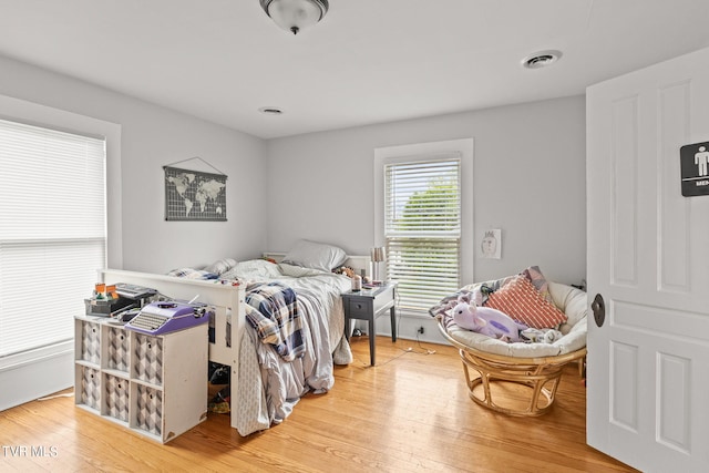 bedroom with light hardwood / wood-style flooring