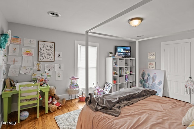 bedroom with wood-type flooring