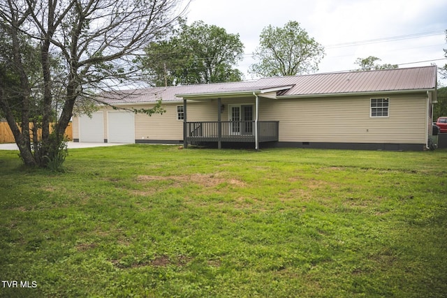 1466 Broad St, Elizabethton, TN 37643 - back of house with crawl space, a lawn, metal roof, and a garage
