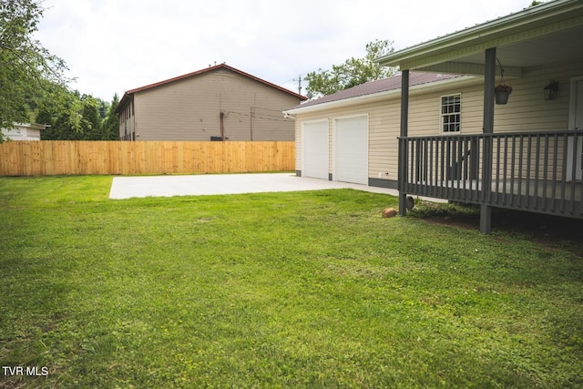 1466 Broad St, Elizabethton, TN 37643 - view of yard featuring a deck, a garage, and fence