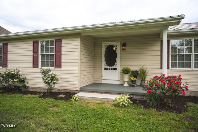 1466 Broad St, Elizabethton, TN 37643 - entrance to property with a lawn, covered porch, and metal roof