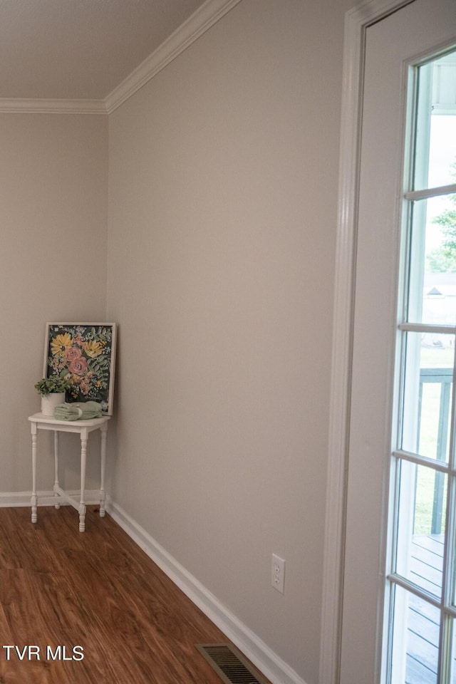 1466 Broad St, Elizabethton, TN 37643 - empty room with a wealth of natural light, visible vents, crown molding, baseboards, and dark wood-style flooring