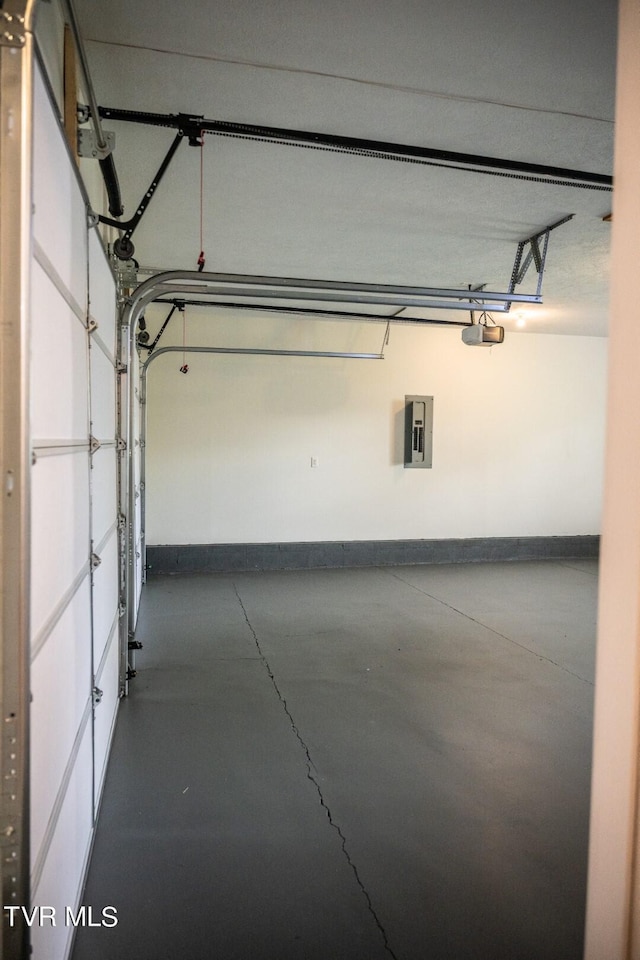 1466 Broad St, Elizabethton, TN 37643 - garage with electric panel, baseboards, and a garage door opener