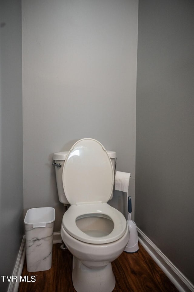 1466 Broad St, Elizabethton, TN 37643 - bathroom with toilet, baseboards, and wood finished floors