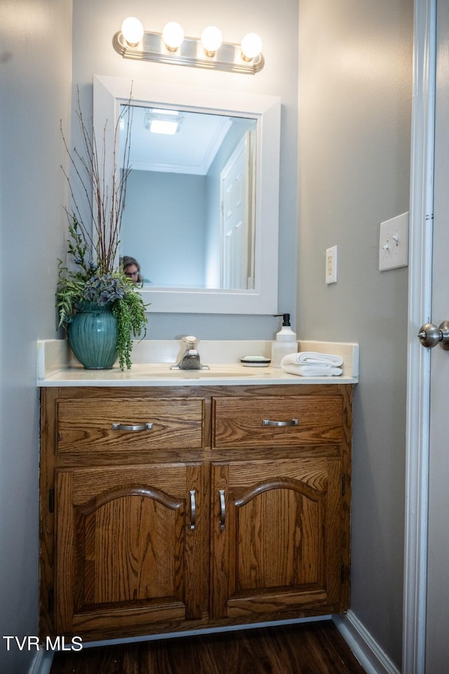 1466 Broad St, Elizabethton, TN 37643 - bathroom with baseboards, wood finished floors, and vanity