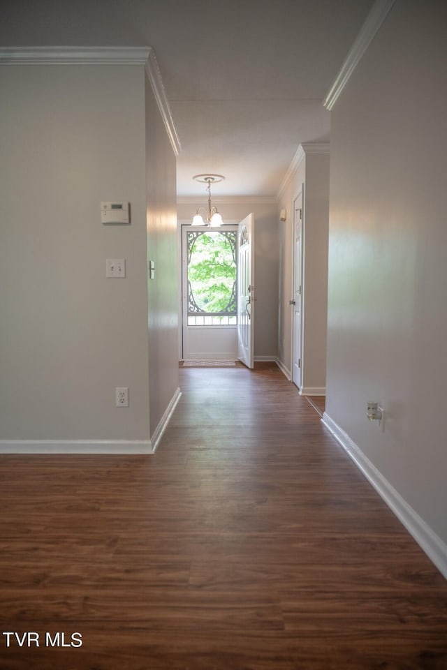 1466 Broad St, Elizabethton, TN 37643 - interior space featuring dark wood-style floors, a notable chandelier, baseboards, and ornamental molding