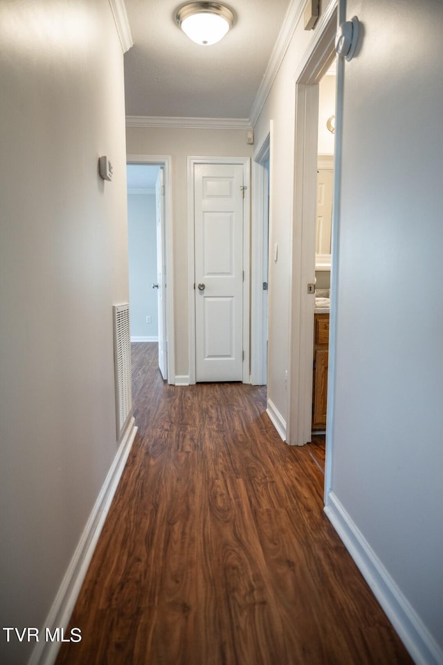 1466 Broad St, Elizabethton, TN 37643 - corridor with visible vents, baseboards, dark wood-style flooring, and crown molding