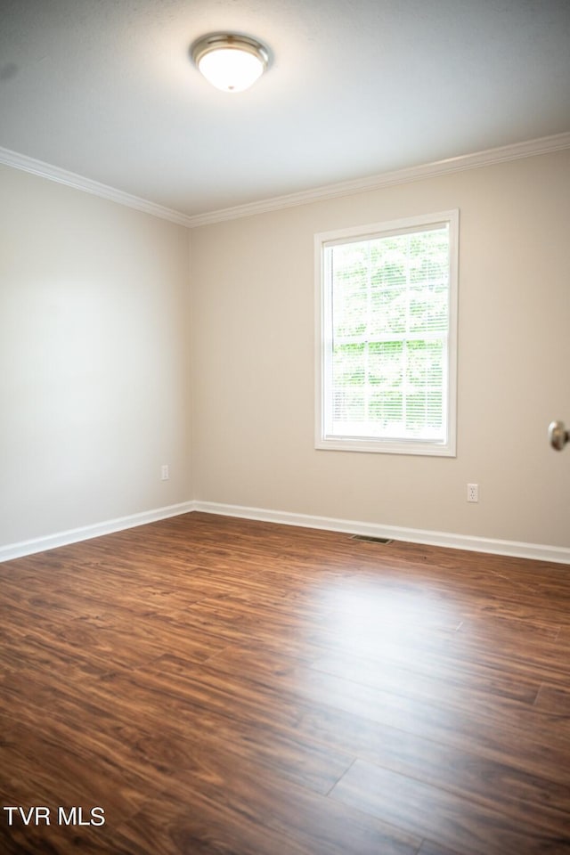 1466 Broad St, Elizabethton, TN 37643 - empty room with baseboards, dark wood-style floors, and crown molding