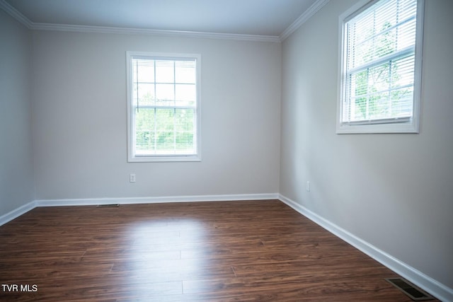 1466 Broad St, Elizabethton, TN 37643 - spare room with crown molding, plenty of natural light, dark wood-style floors, and visible vents