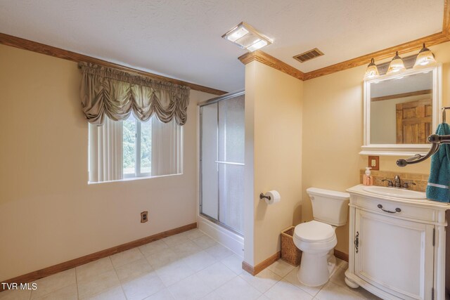 bathroom with vanity, an enclosed shower, crown molding, and toilet