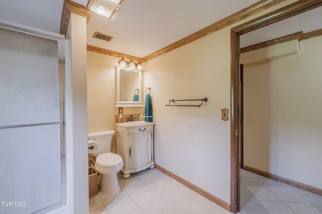 bathroom featuring a shower with shower door, sink, toilet, crown molding, and tile patterned floors