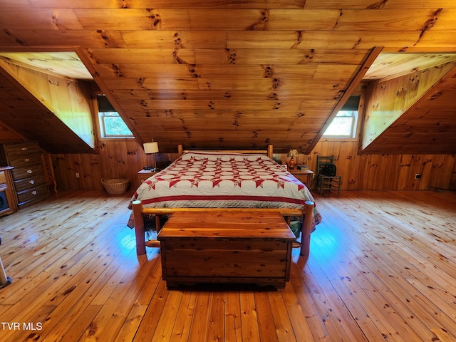 unfurnished bedroom with light hardwood / wood-style flooring, wooden ceiling, and vaulted ceiling