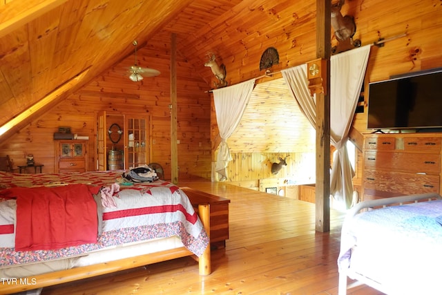 bedroom featuring hardwood / wood-style flooring, wooden ceiling, vaulted ceiling, and wood walls