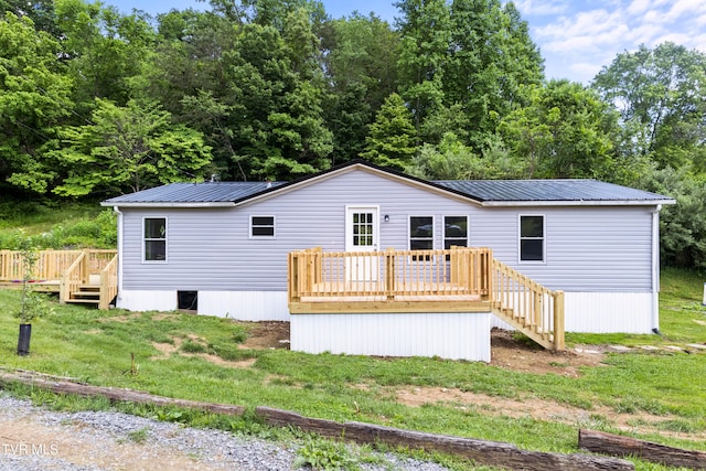 exterior space featuring a wooden deck and a front lawn