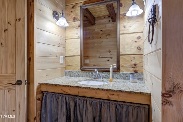 bathroom featuring vanity, wooden ceiling, and wood walls