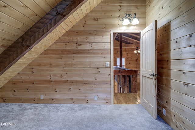 bonus room with wood ceiling, lofted ceiling, carpet floors, and wooden walls