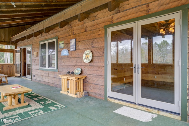 entrance to property featuring french doors and a patio area