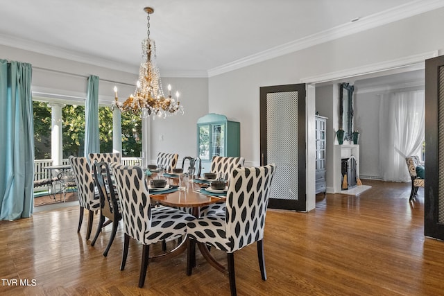 dining space with an inviting chandelier, plenty of natural light, and ornamental molding