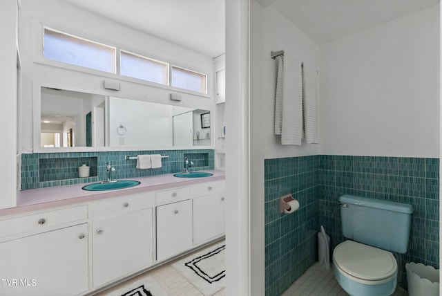 bathroom with backsplash, tile walls, toilet, and tile floors