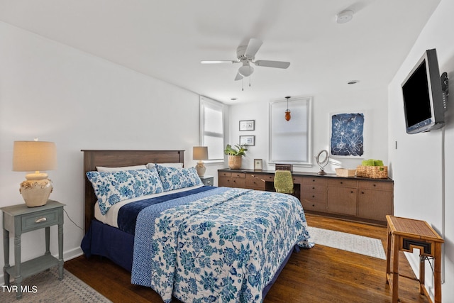 bedroom featuring dark hardwood / wood-style flooring and ceiling fan