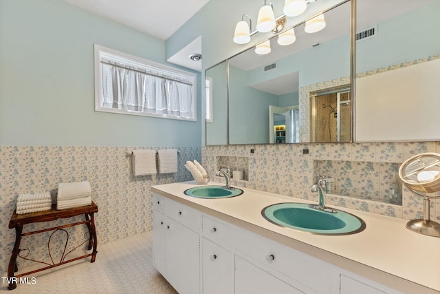 bathroom featuring tile flooring and double sink vanity