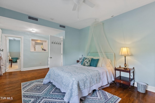 bedroom with dark hardwood / wood-style floors and ceiling fan