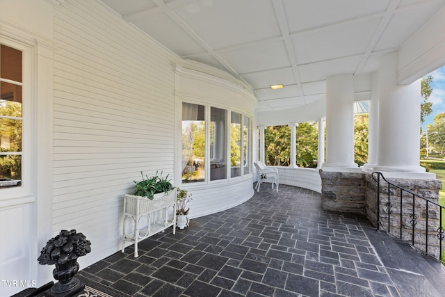 sunroom / solarium with coffered ceiling and decorative columns