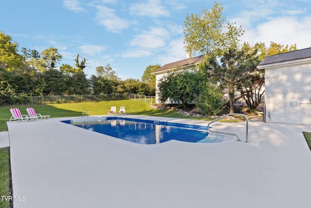 view of pool featuring a patio and a lawn