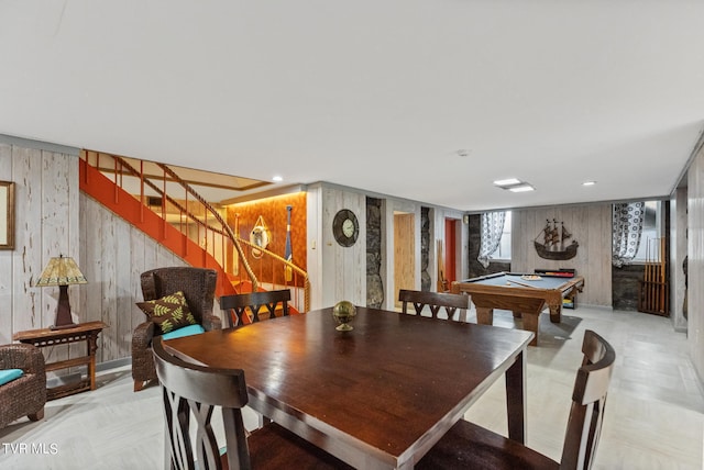 dining space with wooden walls and billiards