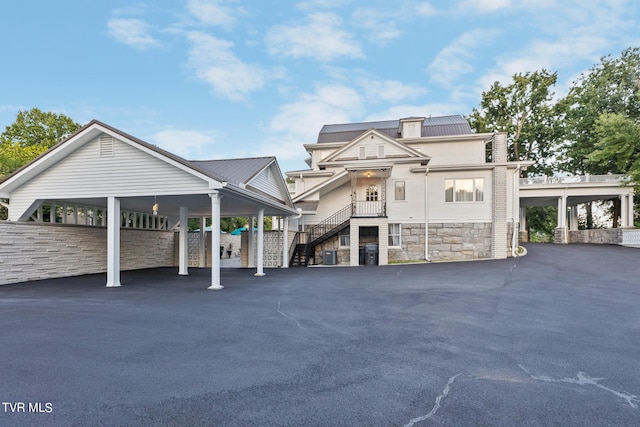 view of front of property featuring a carport