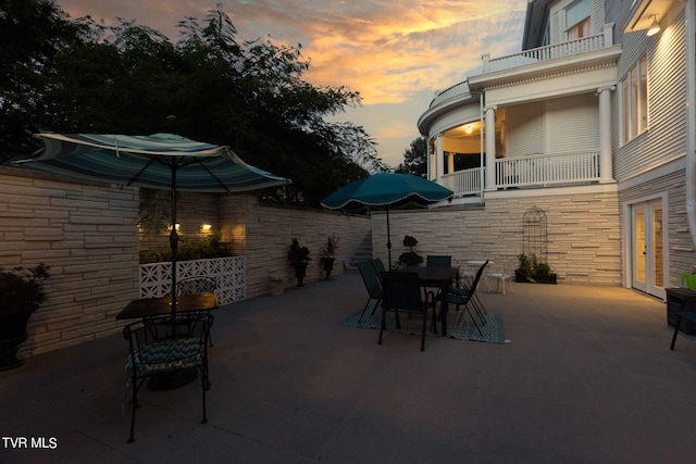 patio terrace at dusk with a balcony