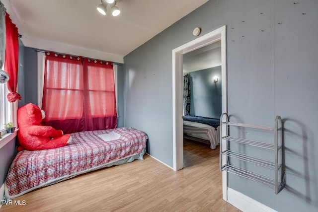 bedroom with wood finished floors